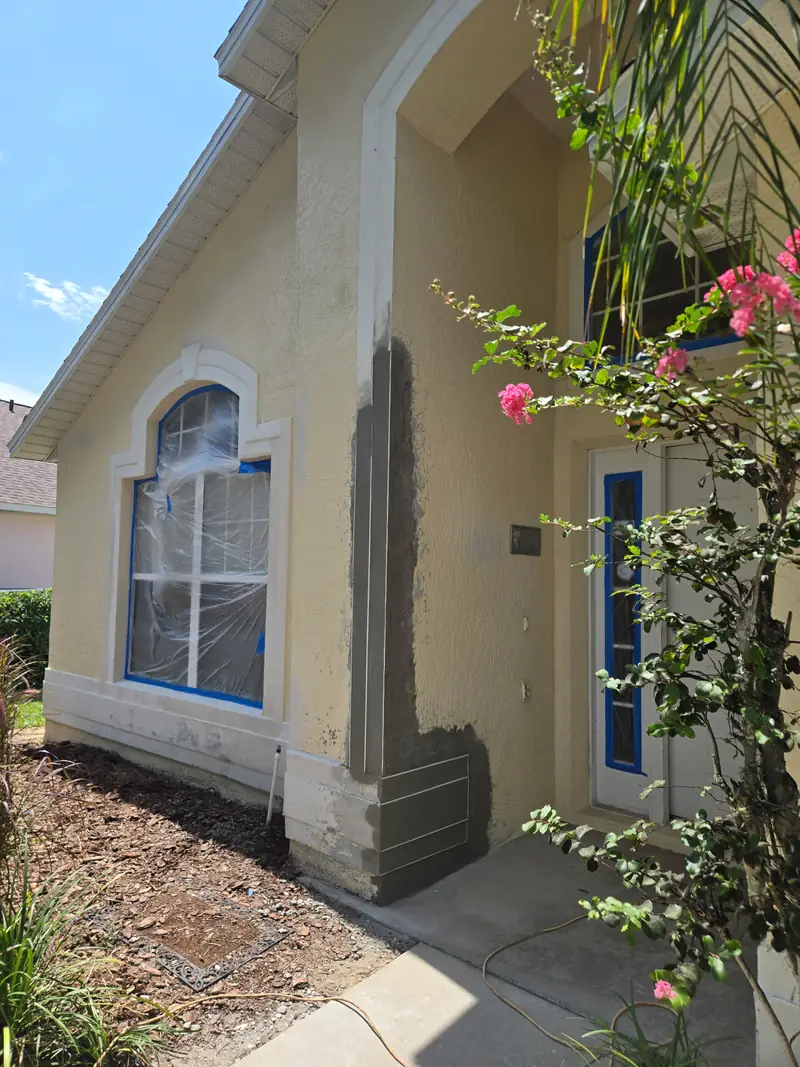 Entry column rebuilt and sealed in a stucco base coat