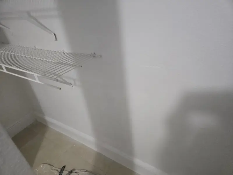 Wall painted to match, shelving reinstalled